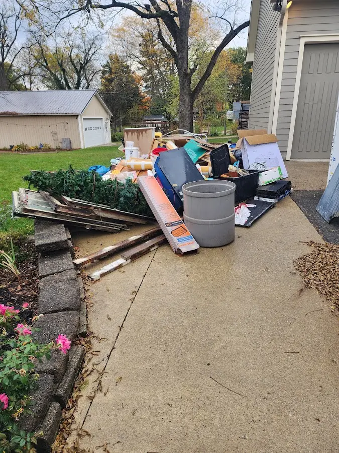 Dumpster being loaded with debris for Estate Cleanout Dumpster Rental in Duvall